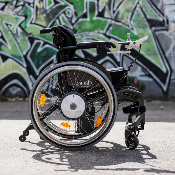 Alber e-fix E35 powered wheels and arm-mounted joystick fitted to a manual wheelchair